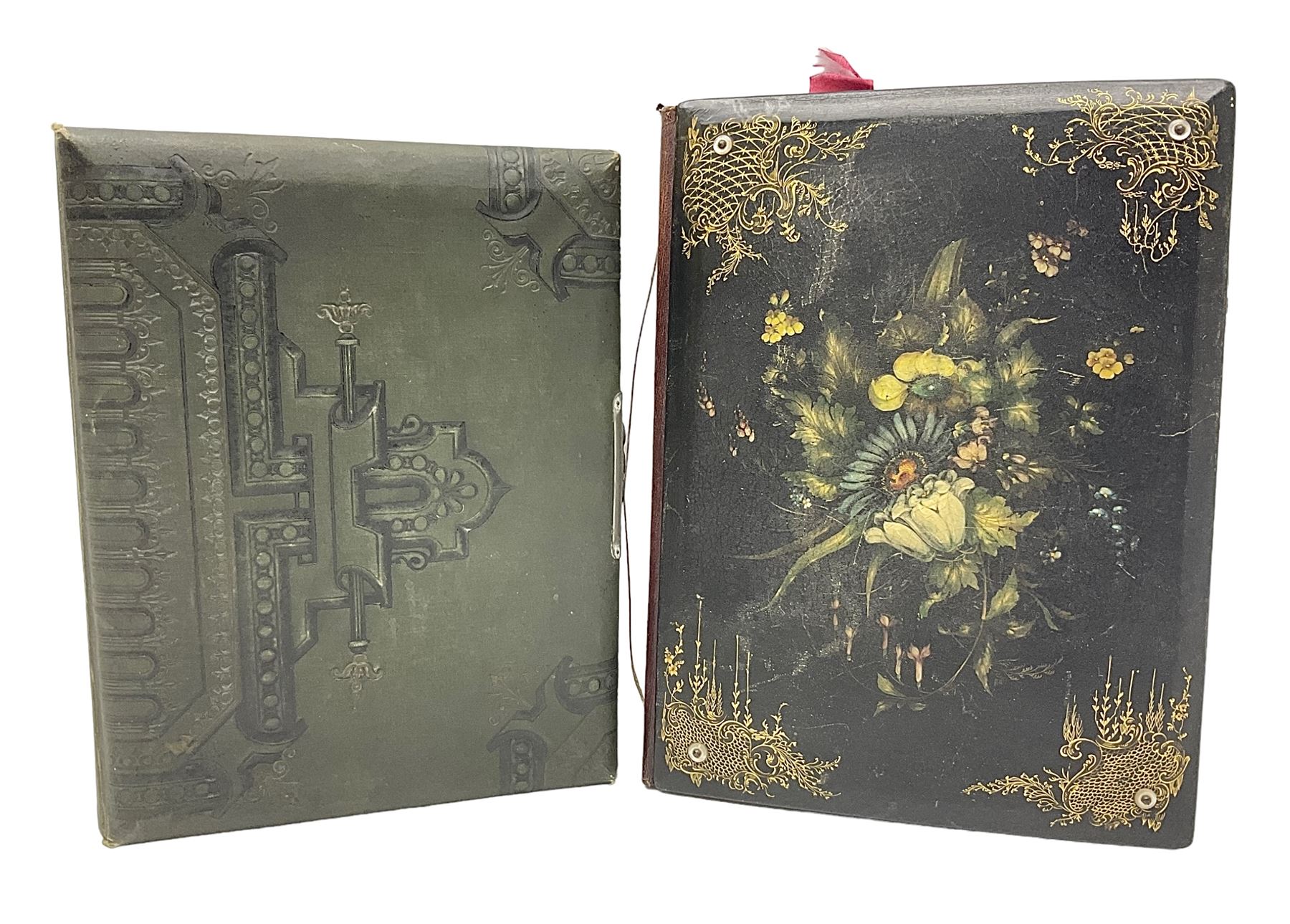 Victorian desk ink blotter, decorated with painted spray of flowers within stylised gilt rococo spandrels with mother of pearl fixings, together with a Victorian photo album containing interior leaves with apertures of various sizes and shapes of portraits surrounded by printed sea and dock scenes, blotter L28cm