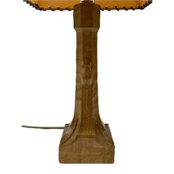 'Mouseman' tooled oak table lamp, the octagonal tapered stem carved with mouse signature, with shade, by Robert Thompson of Kilburn