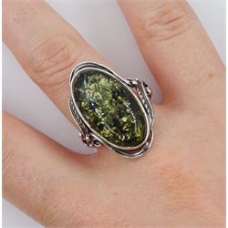 Silver single stone green amber ring, stamped 925