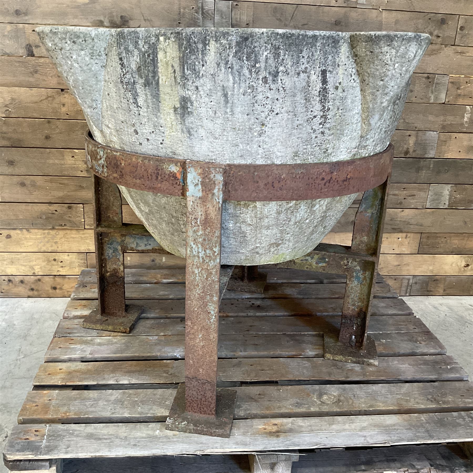 Large 19th century circular stone mortar planter on wrought iron stand