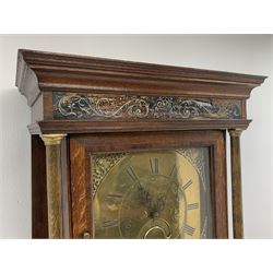 Early 19th century oak longcase clock, projecting cornice over frieze painted with scrolls, square glazed door enclosed by plain pilasters, square brass dial with ornate cast metal spandrels, Roman chapter ring and false subsidiary date aperture, engraved decoration and inscribed 'Torkington, Newcastle', 30-hour movement striking on bell