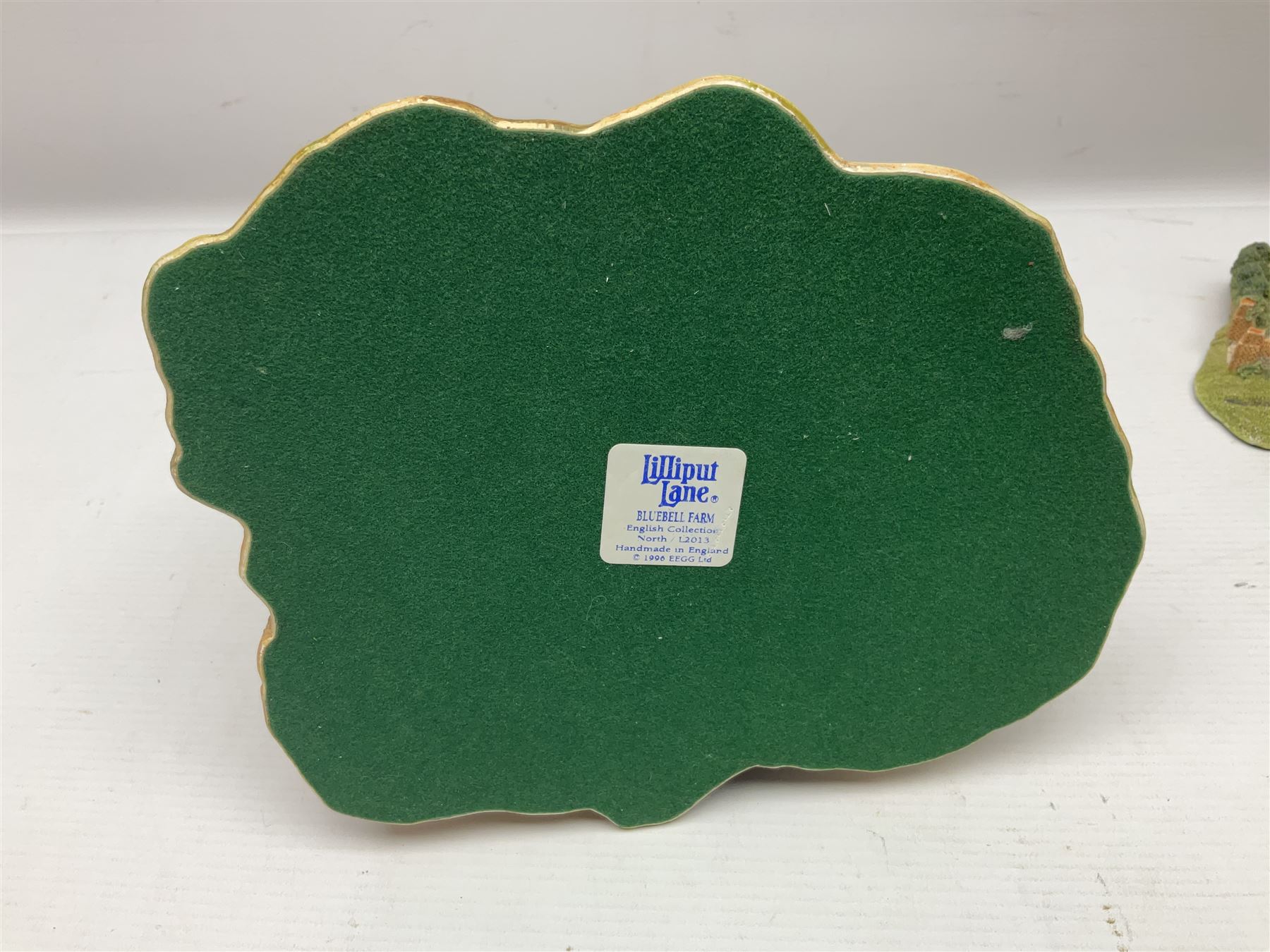 Three Lilliput lanes, comprising Oakwood Smithy, Anne of Cleves and Bluebell Farm, all with deeds and original boxes 