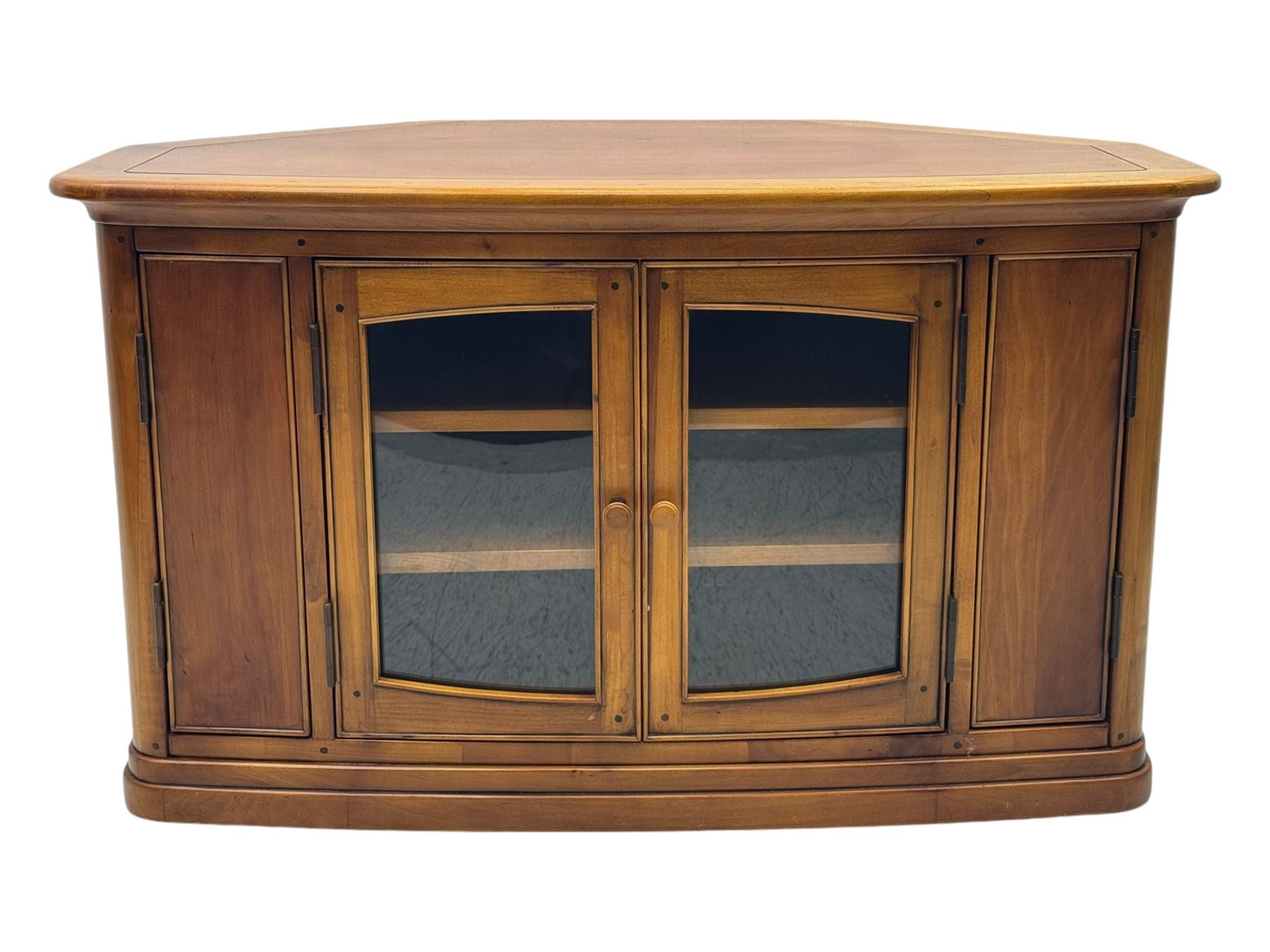 Contemporary cherry wood corner TV unit, canted top over central glazed double doors opening to shelves for media storage, flanked by side storage compartments, on a plinth base
