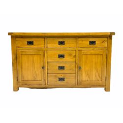 Light oak sideboard, fitted with six drawers and two cupboards 