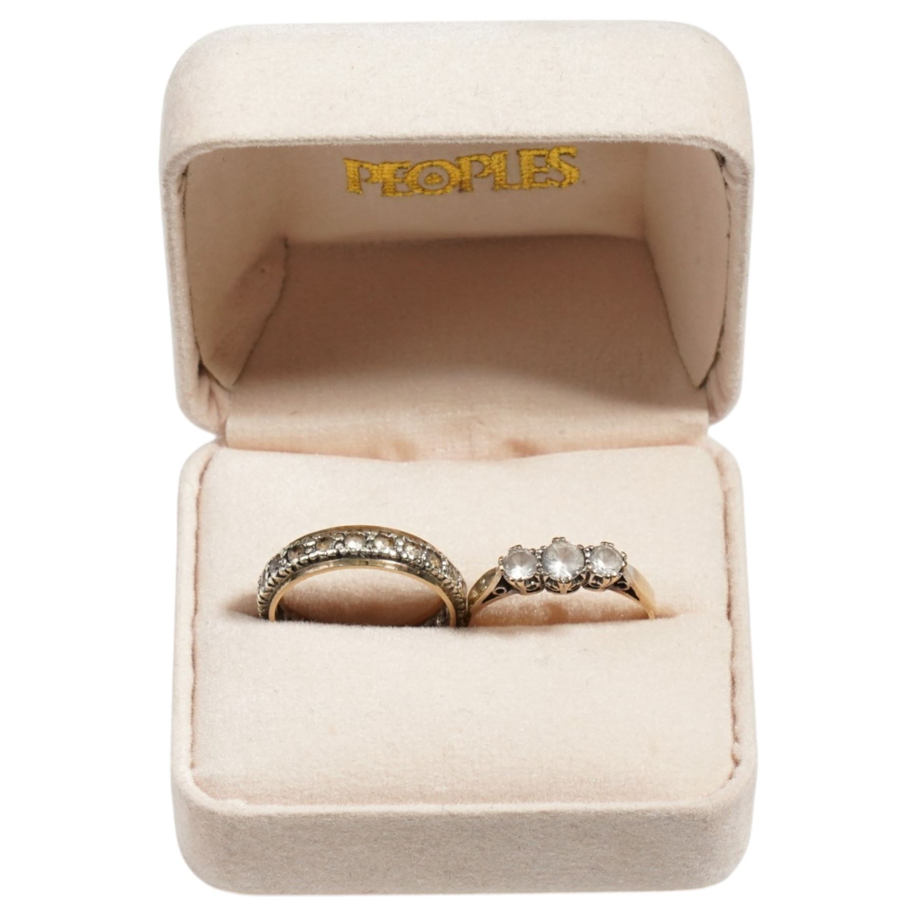 Gold white spinel full eternity ring and a three stone white spinel ring, both 9ct