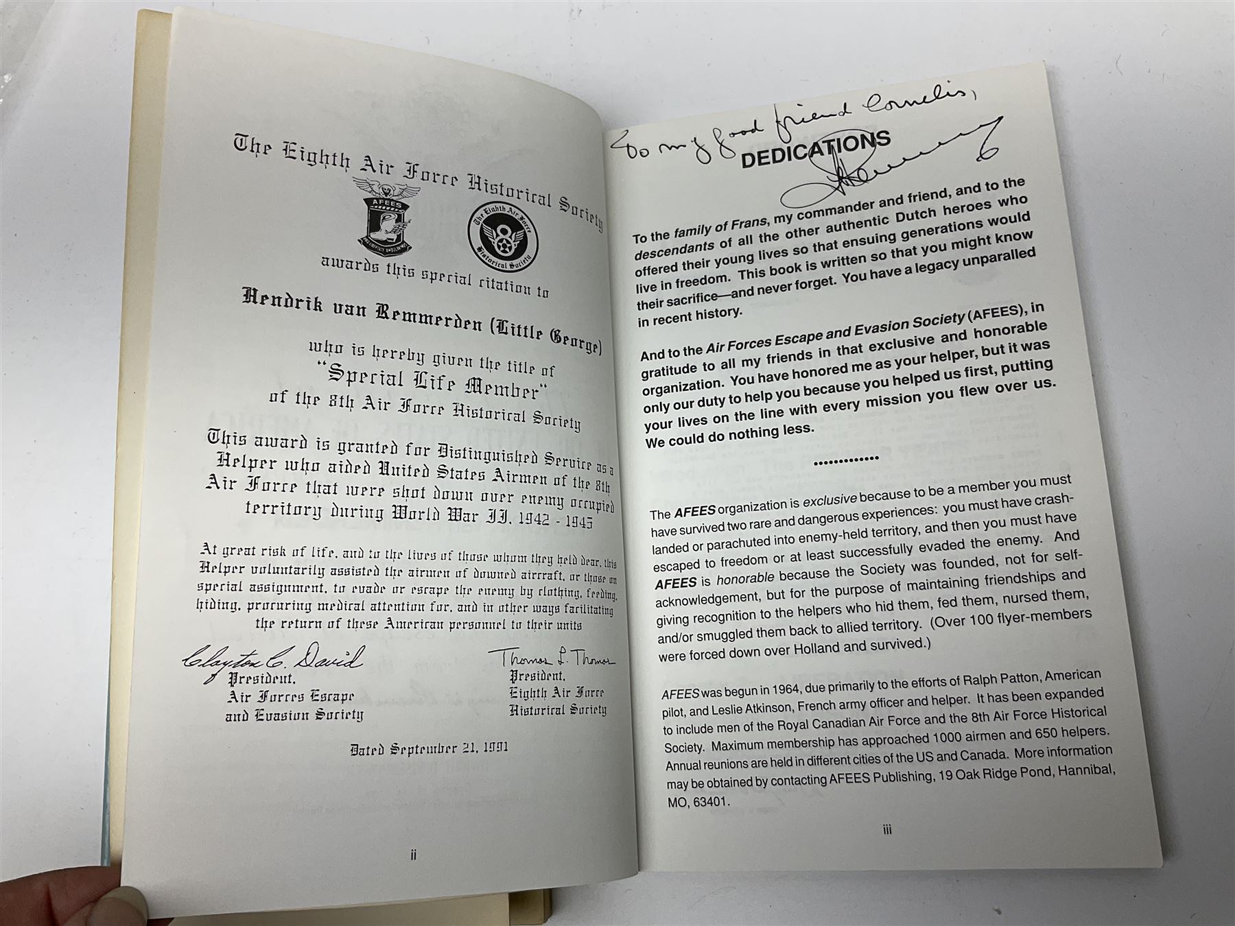 Two signed WWII books, comprising They Helped Me Escape: From Amsterdam to Gibraltar in 1944 by Clayton C.David, and In the Shadow of the Swastika by H. Van Remmerden