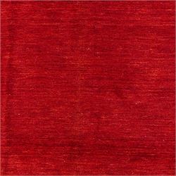 Two contemporary Moroccan Berber hand-woven rugs, deep madder red field of plain design, 199x153cm, other with deep madder red field with a simple lattice of ivory lines forming panels with some tonal variation, 190x146cm 