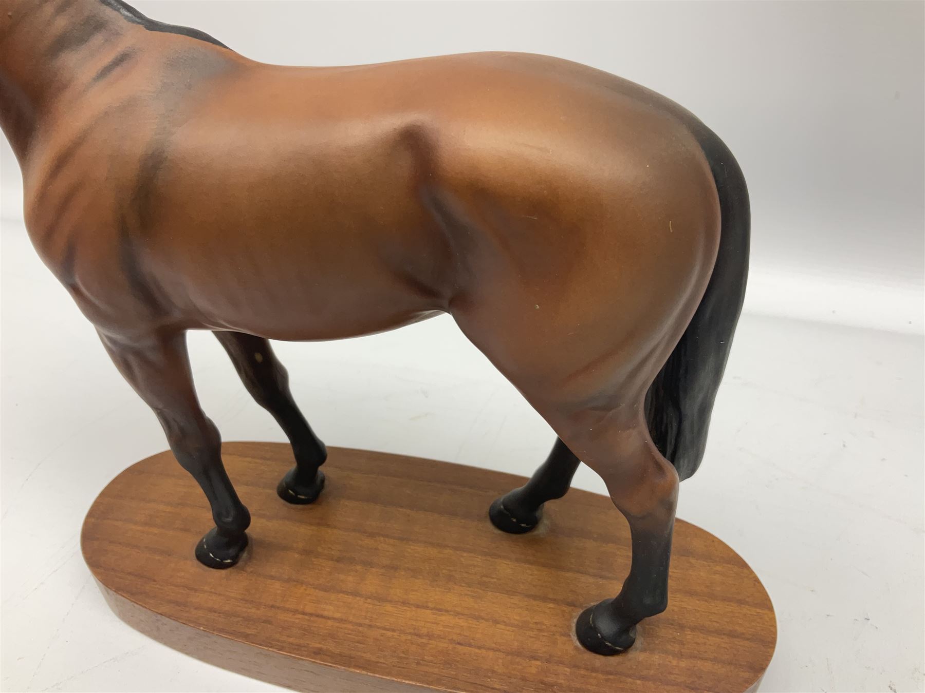 Beswick 'Mill Reef' horse figure, on a wooden plinth together with Beswick Ware horse figure 'Red Rum' on wood plinth, both with printed mark beneath