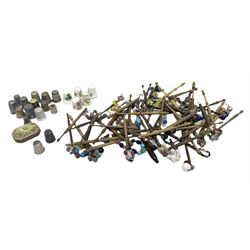 Assorted wooden lace making bobbins, together with a collection of thimbles, including a silver, hallmarked, thimble, Royal Worcester thimble etc. 
