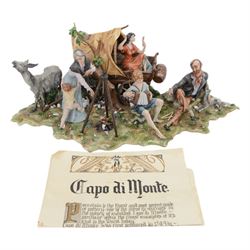 Capodimonte figural group of a gypsy encampment including wagon, cooking fire and people, H21cm