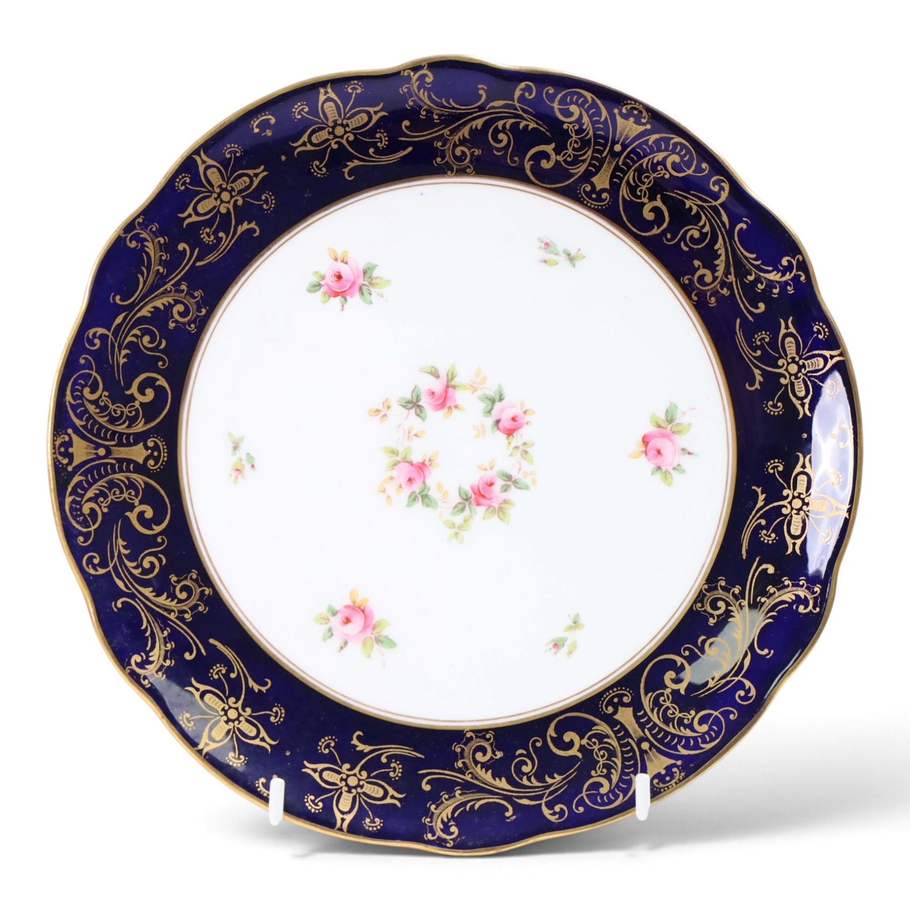 Coalport set of ten plates and four serving plates, each decorated with floral sprigs within a cobalt blue boarder with gilt detail, plates D22cm