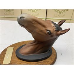 Beswick set of horse head wall plaques 'Champions all', comprising Arkle no.2700, The Minstrel no.2701, Red Rum no.2702, Troy no.2699, all with original boxes