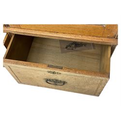 Late Victorian walnut triple combination wardrobe, projecting moulded and dentil cornice, central shaped bevelled mirror glazed door, cartouche and curled leaf carved panels over figured walnut veneered panels, fitted with drawer to base, on bracket feet