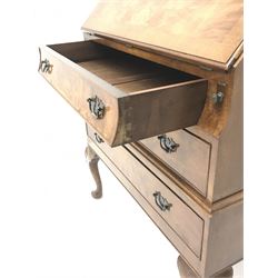 20th century crossbanded walnut bureau, fall front enclosing fitted interior three graduating drawers, shell calved cabriole legs and pad feet 