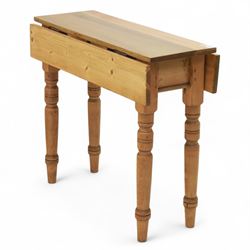 Late 20th century pine occasional table, the rectangular top with twin drop leaves support...