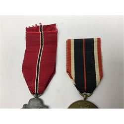German War Merit Cross 1st Class, the pin-back stamped '50'; War Merit Medal; and Ostfront Medal for the Winter Campaign in Russia of 1941-1942 'Die Medaille Winterschlacht Im Osten'; all with ribbons (3)