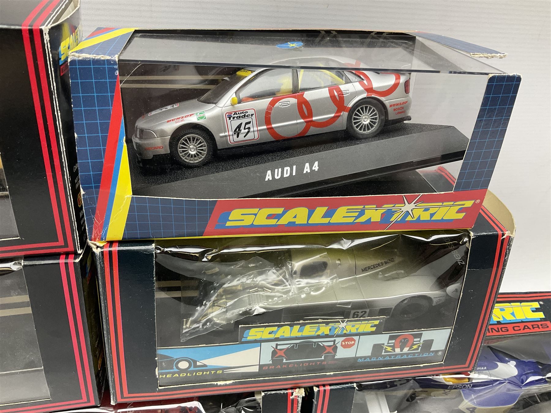 Scalextric by Hornby - seven cars comprising C486 Porsche 962 Kenwood, C467 Tyrrell 018, C601 Mercedes Sonax, C699 Mercedes Promarket #5, C468 Sauber Mercedes, C2104 Mini Yellow No.56 and C2002 Audi A4; all boxed (7)