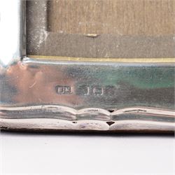 Silver upright photograph frame of plain design, aperture size 21cm x 15cm marks rubbed