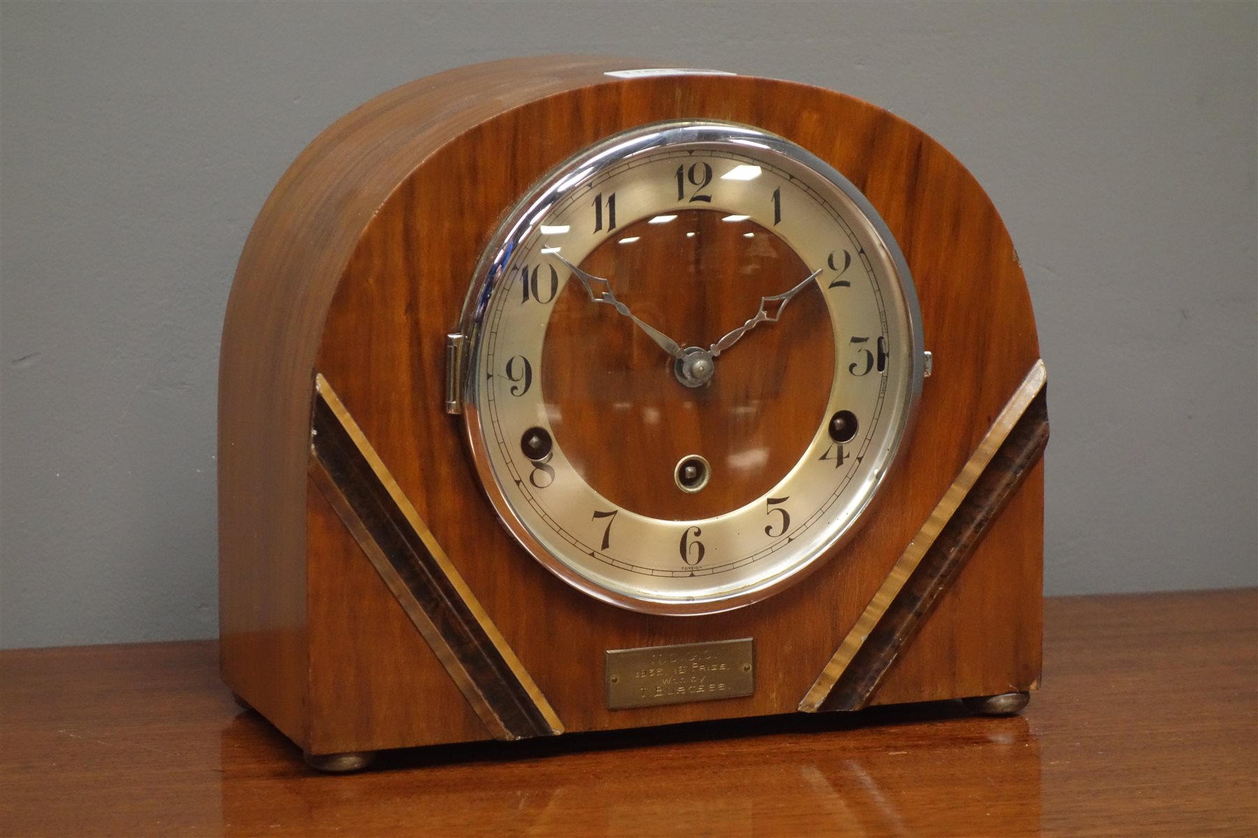 Art Deco walnut cased dome top mantel clock, silvered Arabic chapter