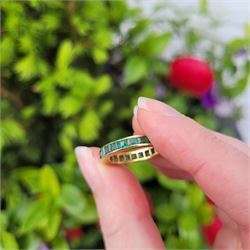 18ct gold emerald full eternity ring, channel set with calibre cut emeralds