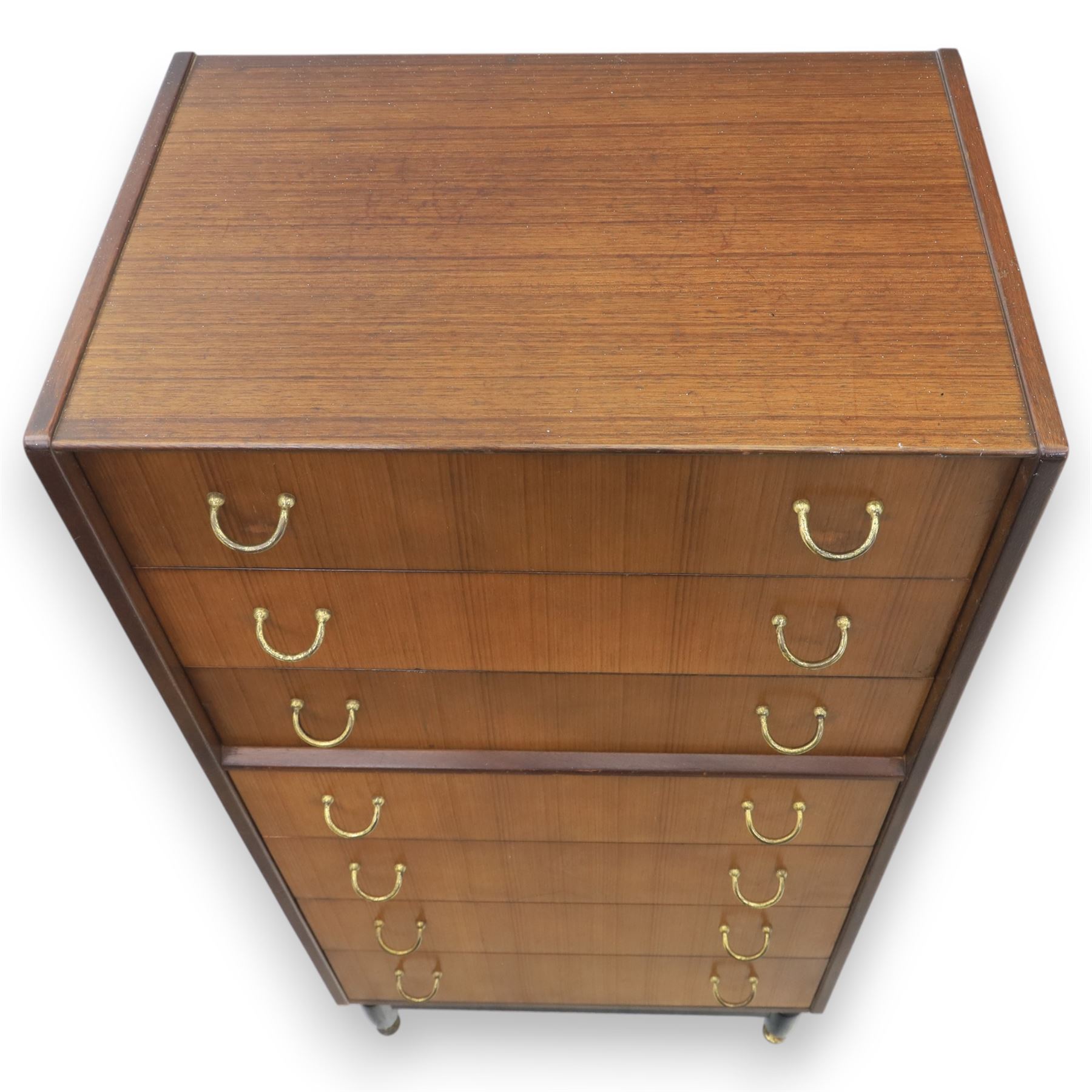 G Plan - 'Librenza' tola wood chest of seven drawers, gold coloured metal pulls on an ebonised based with gold coloured feet