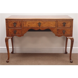  Mid 20th century figured walnut desk/dressing table, five drawers, shaped apron, cabriole legs, W113cm, H77cm, D52cm  