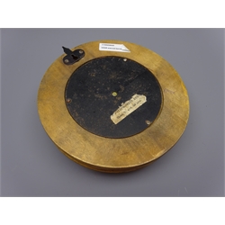  Russian aneroid barometer, circular salmon dial with subsidiary temperature dial and brass bezel, stamped on back 0580231 with paper label, D22cm   