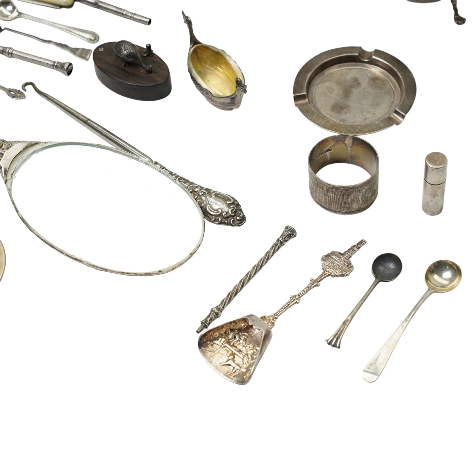 Silver sugar bowl, engine turned silver ashtray, silver napkin ring, silver backed mirror, two silver bladed and mother of pearl fruit knives etc