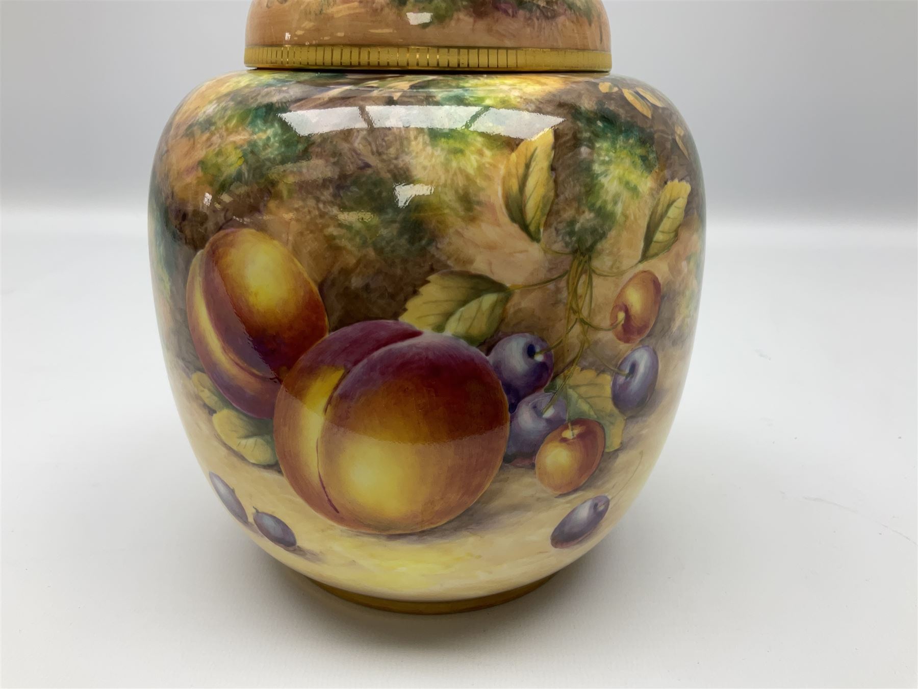 Mid/late 20th century Royal Worcester ginger jar and cover decorated by R Lewis, hand painted with a still life of fruit upon a mossy ground, signed R Lewis, with black printed mark beneath and painted shape number 2826, H17.5cm