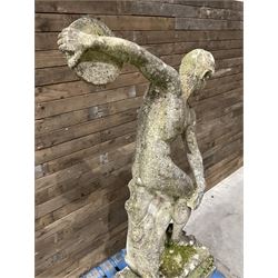 Life-size weathered cast stone Greek Discus Athlete, seated on rectangular slab raised on associated architectural plinth