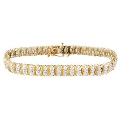 9ct gold diamond chip bracelet, forty-six white gold navette shaped links, each set with t...