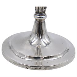 Pair of continental silver candlesticks, probably German Hanau, each of tapering form, with fern leaf decoration, upon a stepped circular base, with Hanau marks and assay scrape to base, H19cm