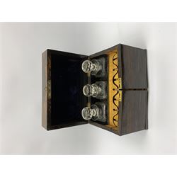 19th century coromandel decanter box, of rectangular form, the hinged cover with vacant central plaque opening to reveal three octagonal and hobnail cut decanters with flat topped stoppers, the front doors opening to reveal a satinwood compartment for seven glasses, H23.5cm L33.5cm D21cm 