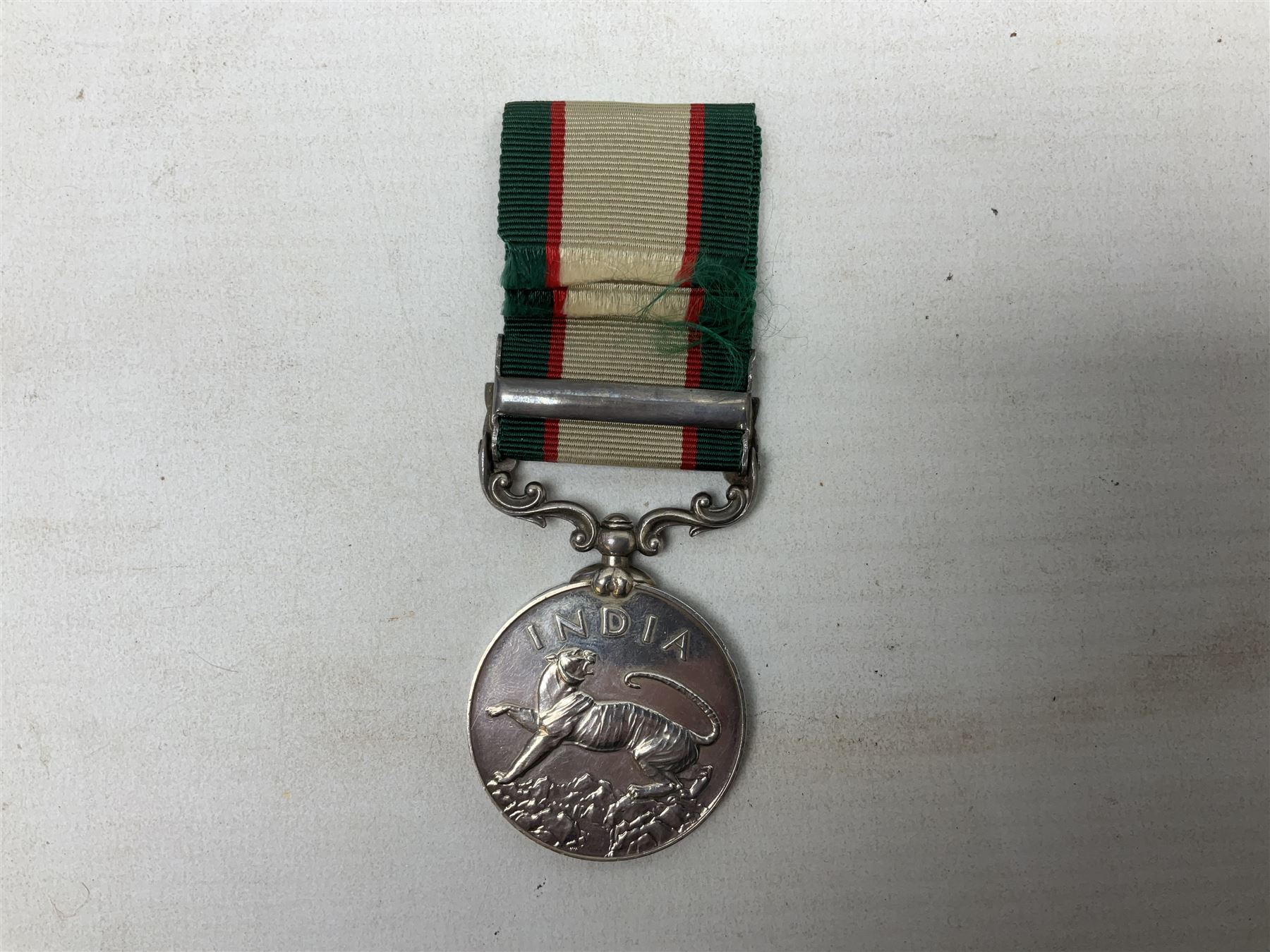 George VI India General Service Medal with North West Frontier 1936-37 clasp awarded to Bearer Khan Akbar 2-Border R.; with ribbon
