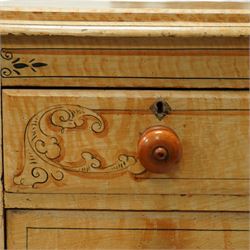 19th century pine painted chest of drawers, rectangular moulded top above two short and three graduated long drawers, each with painted foliate scroll and line detailing, turned knobs, and concealed turned feet, the sides with rounded corners and ebonised detail