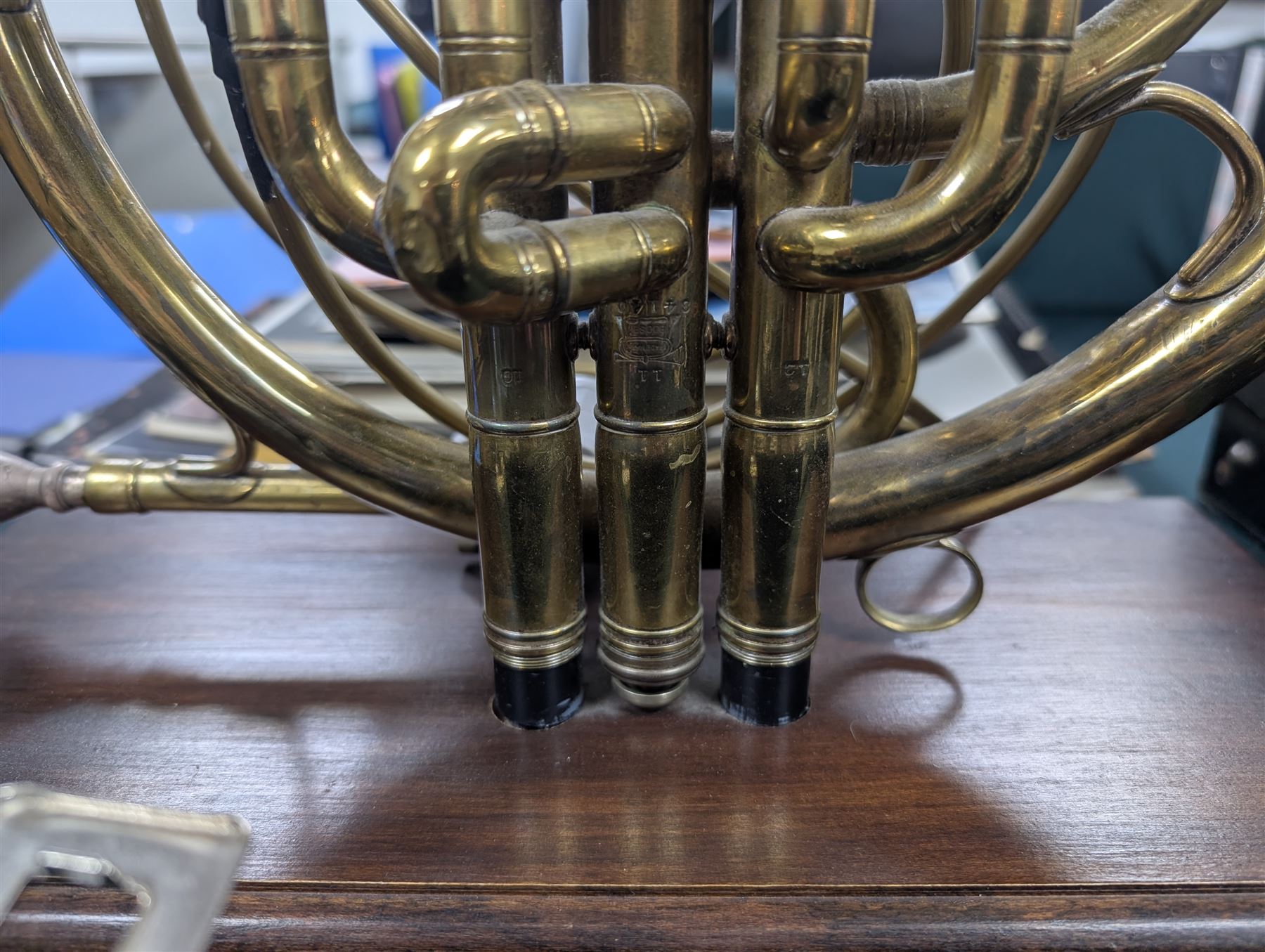 Boosey & Co Ltd French horn, converted into a table lamp, upon a wooden plinth, H45cm
