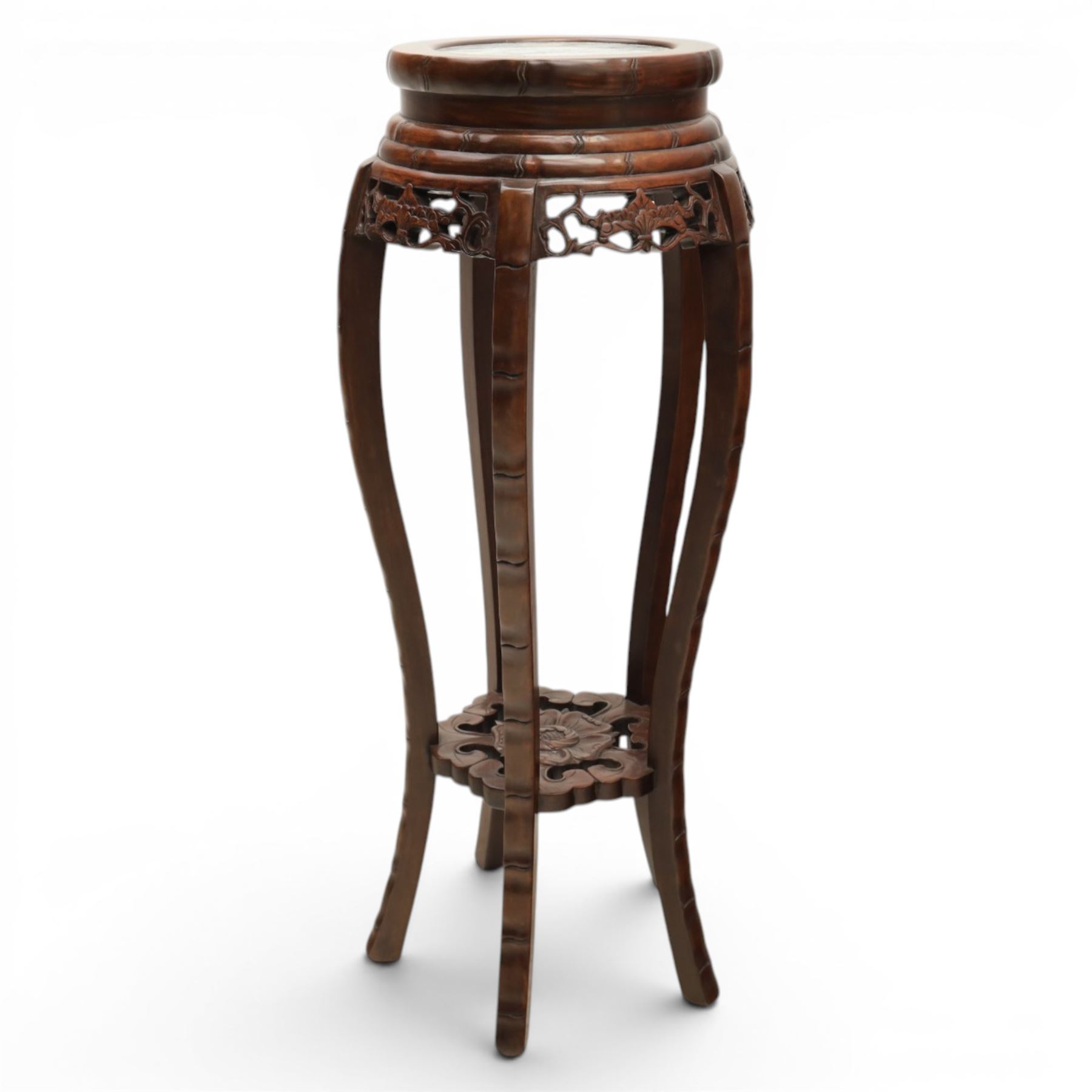 Chinese hardwood jardiniere stand, with inset black veined white marble, pierced carved apron united by rose carved undertier