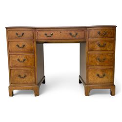 Queen Anne design burr walnut pedestal desk, of serpentine form with green tooled leather inset top, nine drawers with brass swan-neck handles, raised on bracket feet, in three parts