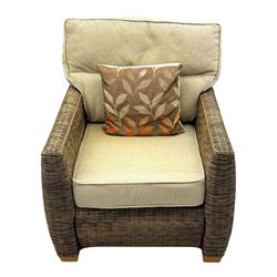 Contemporary two seat rattan conservatory sofa with loose cushions, and pair of matching armchairs, with upholstered seat and back cushions in a beige fabric, curved arms and front complete with scatter cushions 

Chairs (H 92cm, W 75cm, D 84cm)
Sofa (H 92cm, W 130cm, D 84cm)