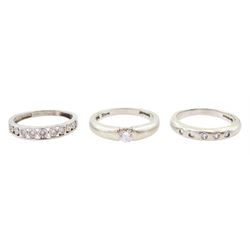 Three 9ct white gold round brilliant cut diamond rings including five stone rubover set, single stone of 0.20 carat and a channel half eternity