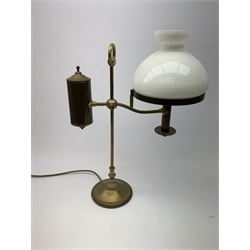 A brass students lamp, with adjustable arm supporting counter weight and white glass shade, H49cm. 