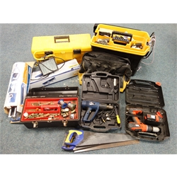  Titan 2000W heat gun, Black and Decker cordless drill, two tile cutters, three tool boxes containing various hand tools of use to the plumbing trade, a tool bag and site lamp, various fittings  