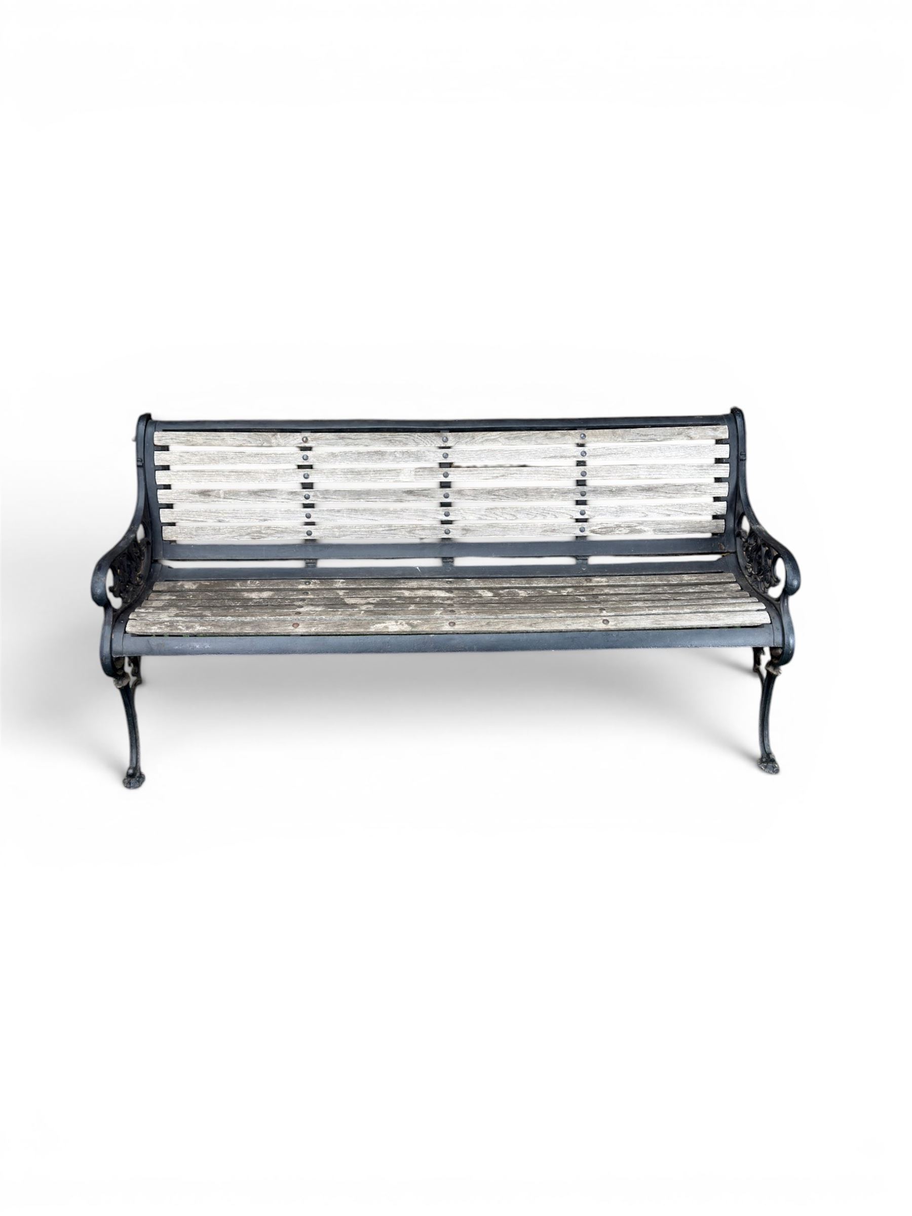 Victorian Andrew McLaren pattern cast iron bench, the ornate ends with detailed scrollwork, joined together with a cast iron seat and backrest frame supporting gently weathered oak slats, Victorian diamond stamp mark