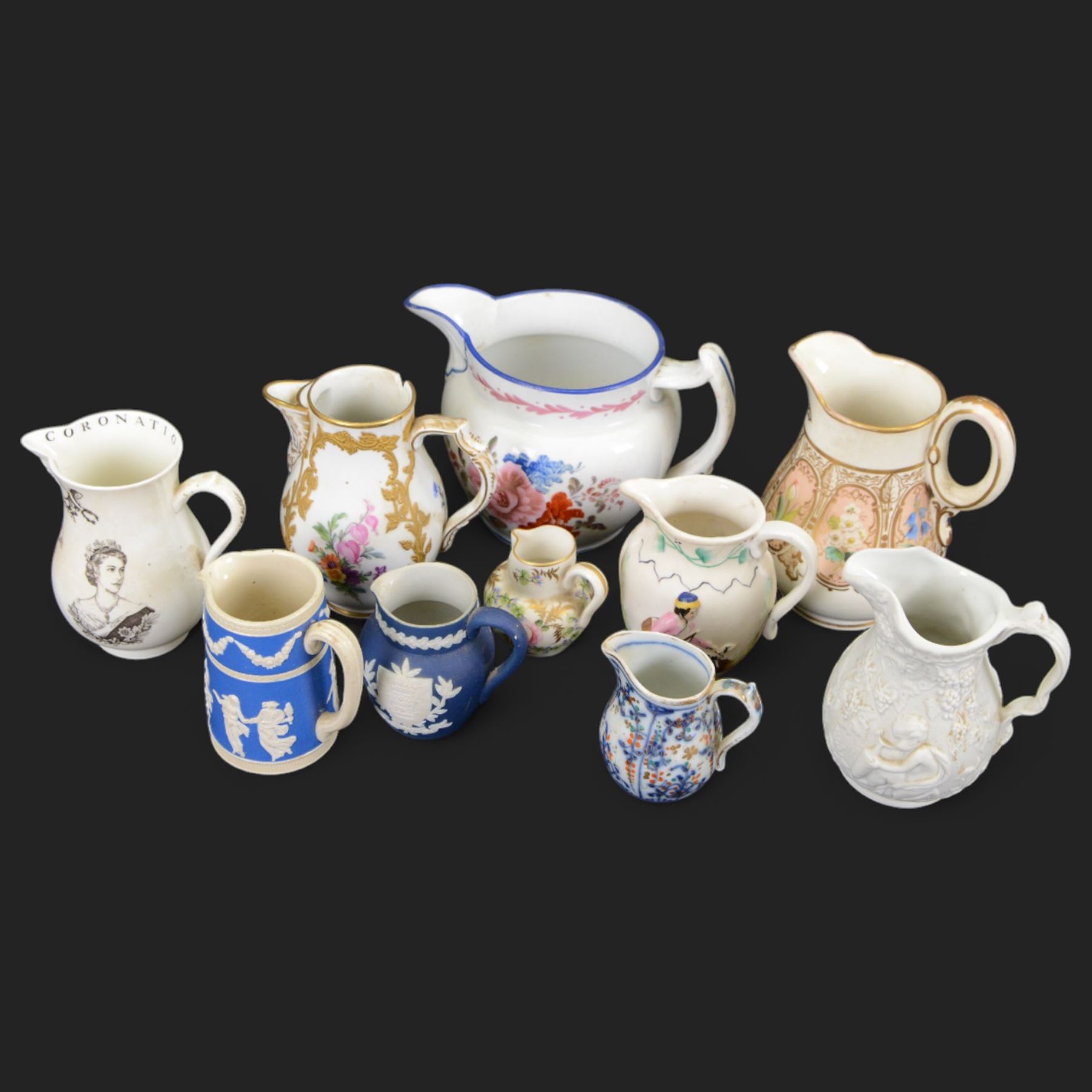 19th century and later ceramic jugs, including small Royal Crown Derby example, painted with florals and gilt leaves, Adams Jasperware Hull jug with town crest, floral KPM example and a Georgian example inscribed Joshua Longfield 1921, etc, tallest H12cm