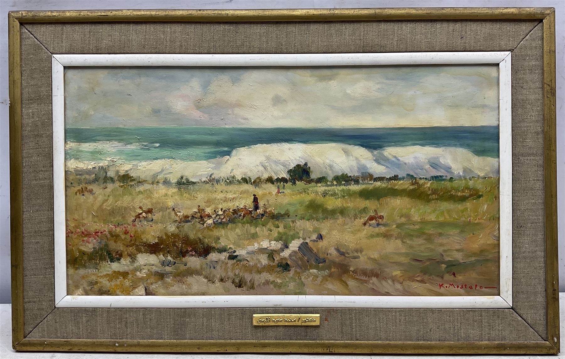 Kamel Moustafa (Egyptian 1917-1982): Goatherd and Flock, oil on panel signed 25cm x 47cm