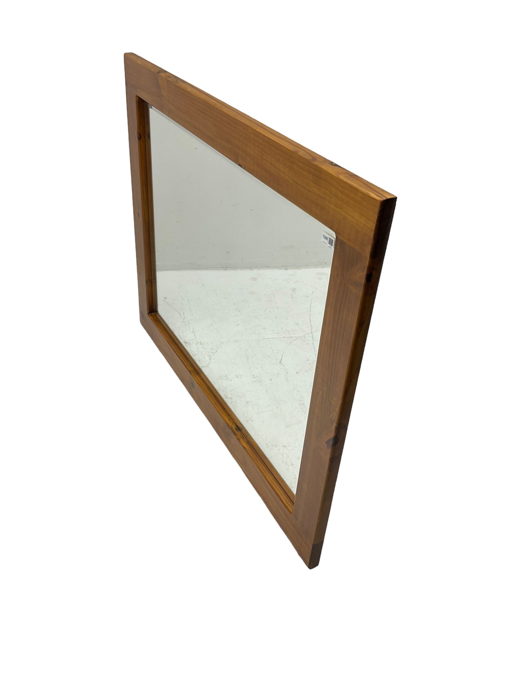 Large pine framed wall mirror, rectangular bevelled plate