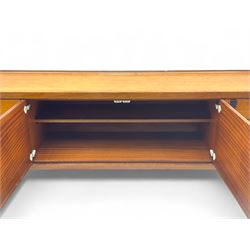 White & Newton - mid-20th century teak sideboard, rectangular top with raised back over fall-front storage compartment, double cupboard and three drawers, raised on cylindrical supports