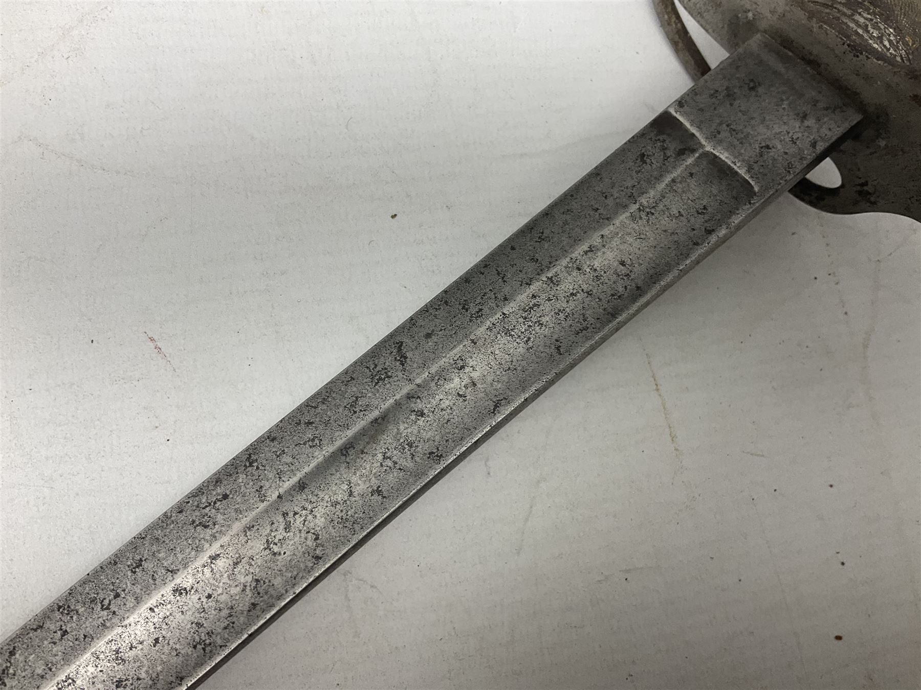 British 1821 Pattern Light Cavalry Officer's sword, with plain 87.5cm slightly curving fullered steel blade and plain steel three-bar hilt with wire-bound fish skin grip and plaited knot on later cord; in steel scabbard with two hanging rings L103cm overall