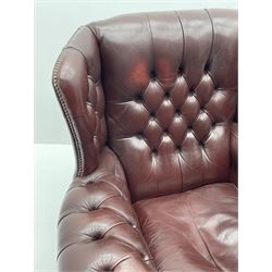 Georgian style vintage wing back armchair, upholstered in deeply buttoned burgundy leather