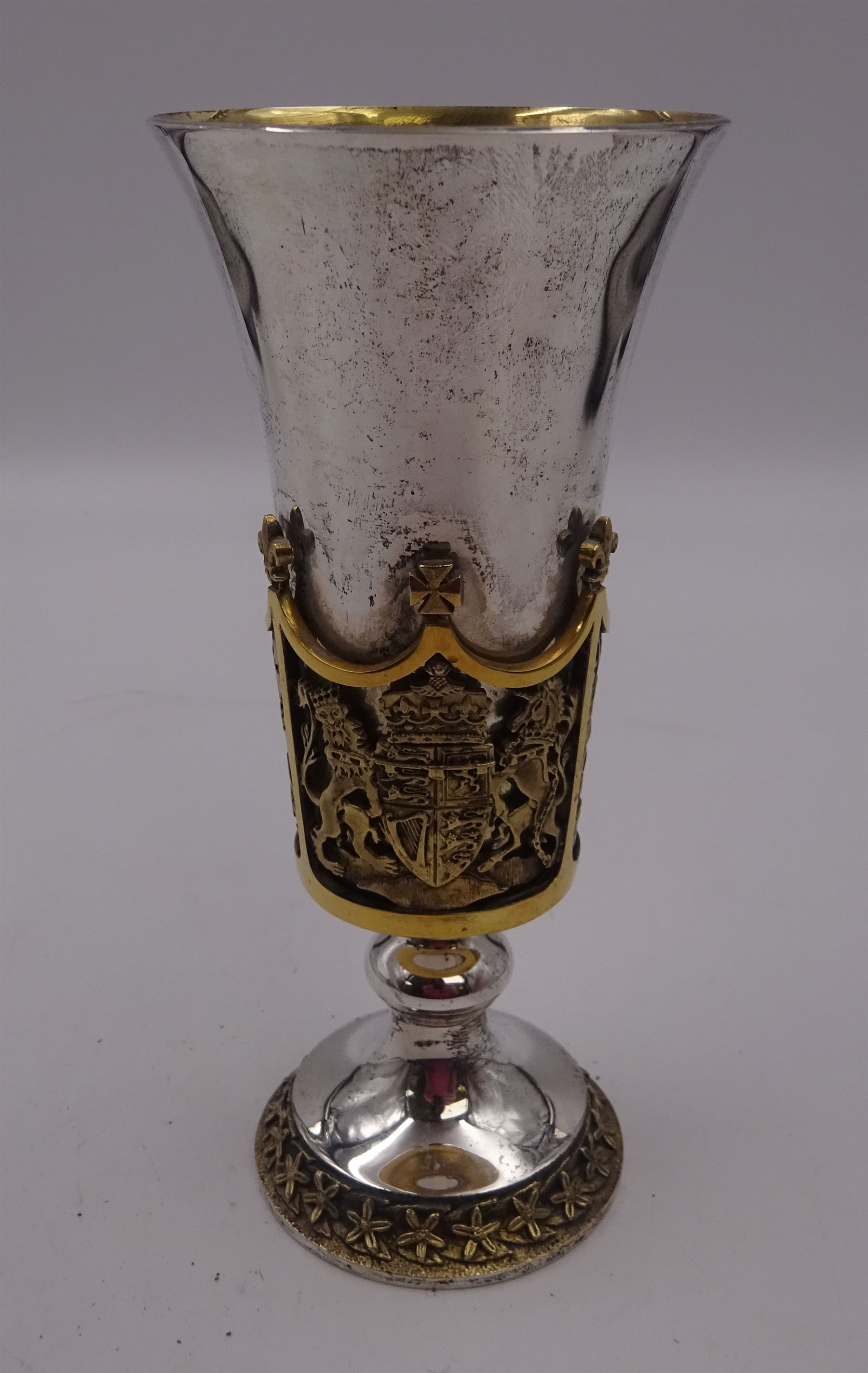 Modern limited edition silver Westminster Abbey Royal Wedding goblet, commemorating the marriage of HRH Prince Andrew and Miss Sarah Ferguson on the 23rd of July 1986, designed by Hector Miller for Aurum, the tapering cylindrical bowl with gilt interior and parcel gilt pierced band to base depicting the Royal Arms, upon knopped stem and circular stepped foot with floral parcel gilt rim, no. 483/750,  hallmarked Hector Miller, London 1986, H17cm